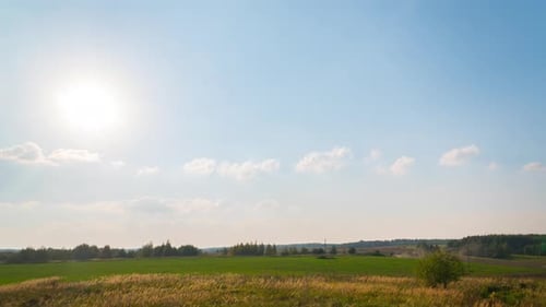 Sunset and tractor working on the field