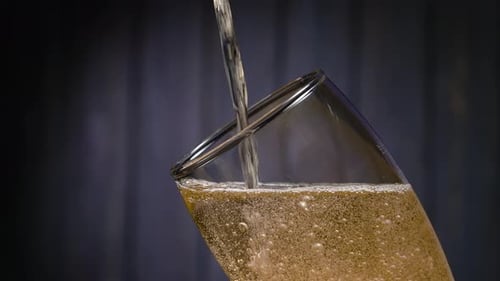 Refreshing Liquid Being Poured Into a Glass