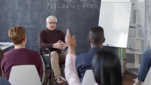Teacher Lecturing a Classroom Full of Students