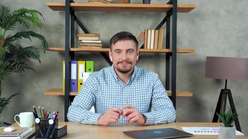 Man with Mustache at Desk Ready to Work