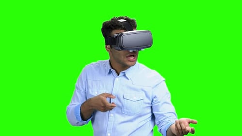 Young Man with VR Headset on Green Screen