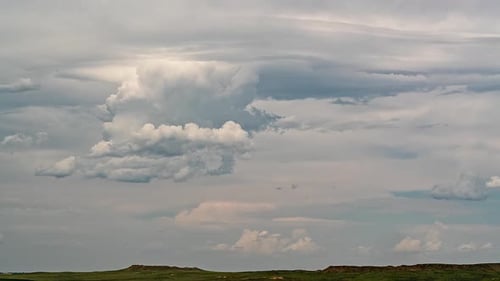 Clouds moving through the sky in timelapse as they brew in the sky