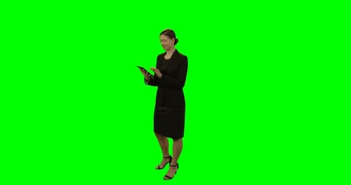 Businesswoman Using Tablet Device on Green Screen