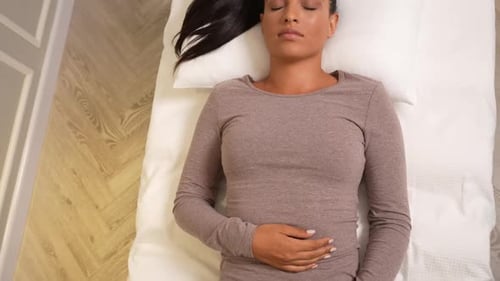 Woman Lying on Pillow