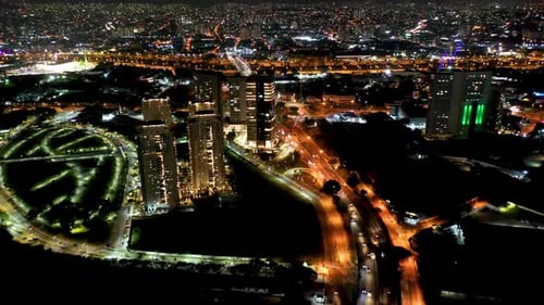 Night city landscape at downtown district. Buildings and traffic.