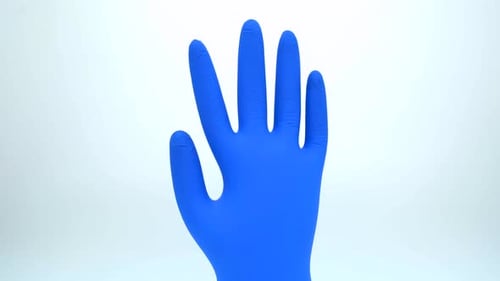 Bright Blue Medical Glove on White Background