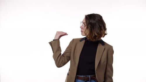 Woman Gesturing About Distance on White Background
