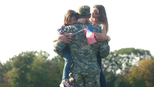 Two Adorable Little Girls with Usa Backgrounds Hug Their Father
