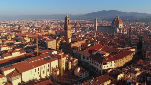 Aerial cityscape with cathedral and Duomo in background, morning light, Florence, Italy