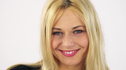 A Young Attractive Woman Smiles at the Camera - Face Closeup - White Screen Studio