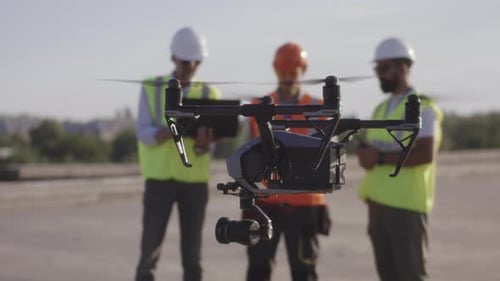 Drone Flying Near Male Builders