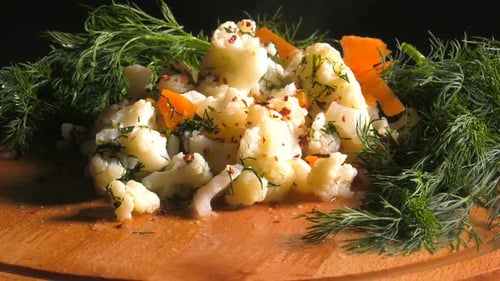 Steaming Cauliflower and Carrot Dish with Fresh Dill