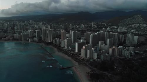 Aerial drone footage of Honolulu, Hawaii.
Beautiful real estate, buildings in the city.
Palm trees