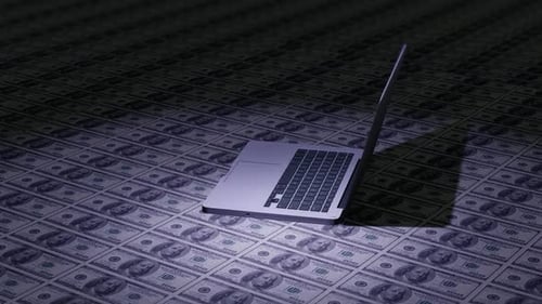 Modern Laptop Appearing on Dollar Bills Background