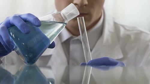 Laboratory Assistant Checking Quality of Drinking Water From New Wellspring