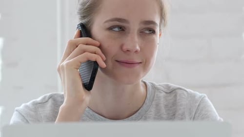 Smiling Woman Talking on Cell Phone