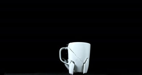 Cup falling and exploding on Black Background, Slow Motion 4K