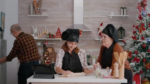 Family Baking Christmas Cookies Together at Home