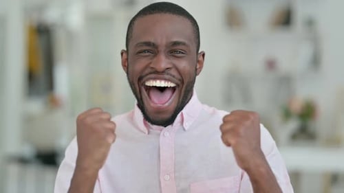 Man Exclaiming and Pumping Fists, Close Up