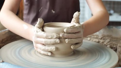 Creating a Clay Pot. Potter. Workshop of Clay. Clay on the Device. Hands Working on Pottery Wheel