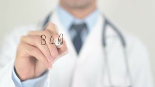 Bladder Cancer Doctor Writing on Transparent Glass