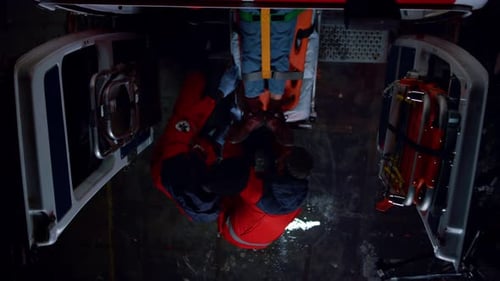 Aerial View of Emergency Medical Personnel Attending Patient