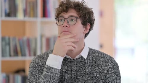 Portrait of Pensive Young Man Thinking Getting Idea
