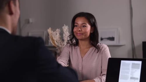 Woman Delivers Cheerful Presentation in Corporate Office