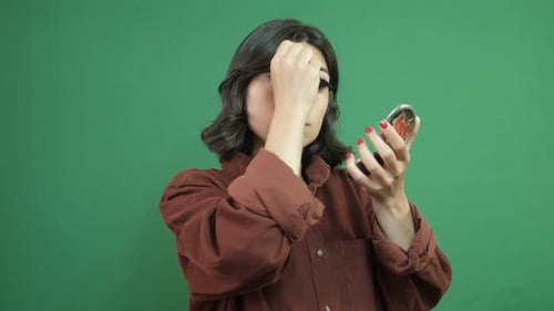 Woman Doing Makeup With Mirror