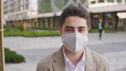 Young Adult Wearing Mask Outside in the City