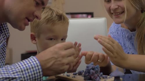 Family Creatively Playing with Play Dough Together