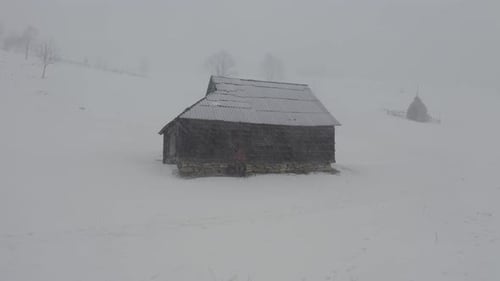 Remote Cabin in Snowy Winter Rural Landscape