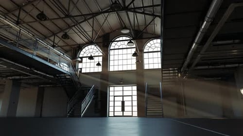 Timelapse of a sunlight leaking through the loft hall's arched windows.