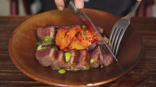 Guest or Waiter Eating Duck Meat Steak in Restaurant High Cuisine Kitchen From Famous Chef Haute