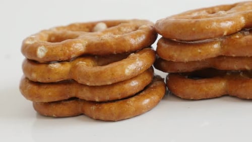 Stack of Delicious Baked Pretzels on White Surface