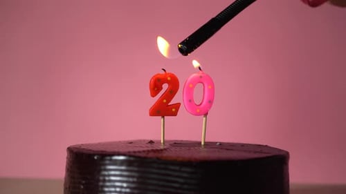 Chocolate Birthday Cake with Wick Lighting Trying to Blowout Candle