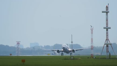 Commercial Airplane Taking Off on Runway
