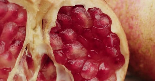 Ripe Pomegranate Half with Red Seeds