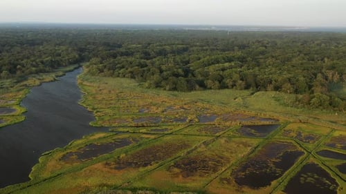 descending crane shot over the waters at East Islip Marina & Park focusing on the marsh area with a