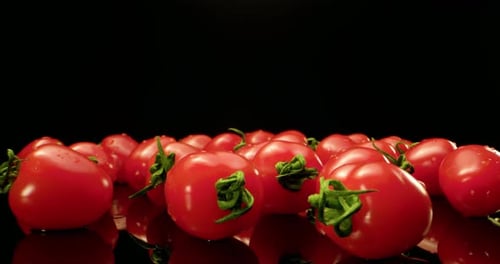 Vibrant Cherry Tomatoes on a Reflective Surface