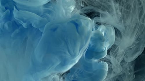 Blue and White Ink Flowing in Water