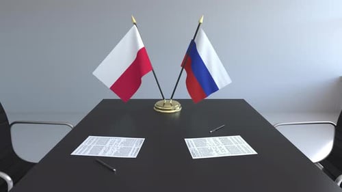 International Corporate Meeting Table with Poland and Russia Flags