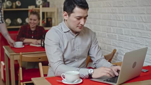 Businessman at Break in Cafe