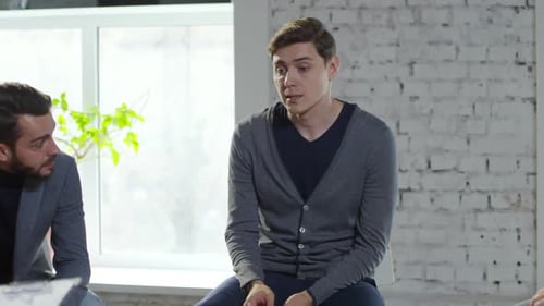 Man Discussing Issues in a Therapy Group