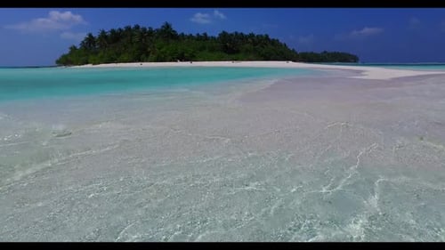 Aerial drone tourism of tranquil resort beach vacation by blue ocean with white sand background of a