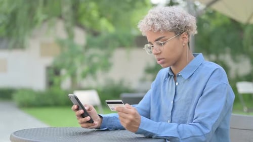 Successful Online Payment on Smartphone By Young African Woman