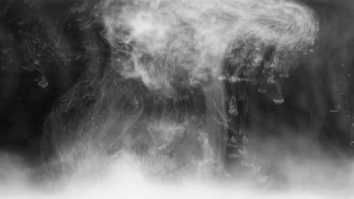 White Ink Suspended Into Water on Background Black Background Dissolving