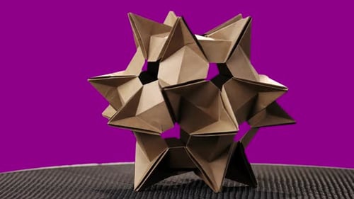 Spiky Origami Figure on Colorful Background.