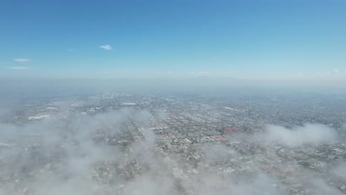 Cityscape Aerial View with Clouds in Urban Setting