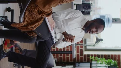 Business Meeting with Man Gesturing in a Workplace